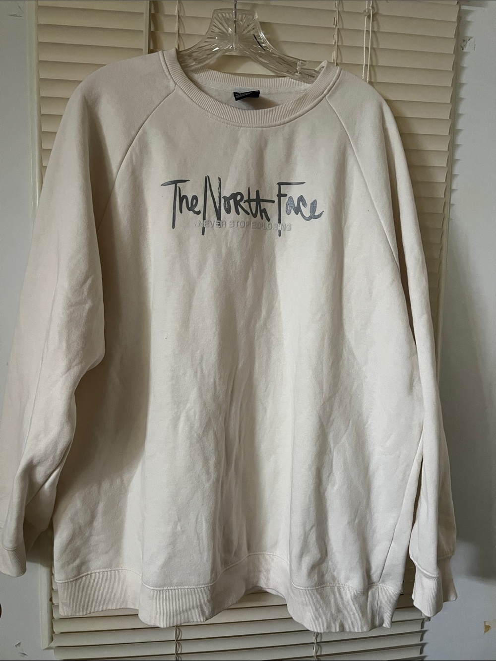 The North Face women’s Cream Crewneck Sweatshirt with Grey Logo